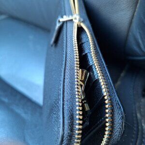 Black coach zip around wallet. If interested, please read the description.
